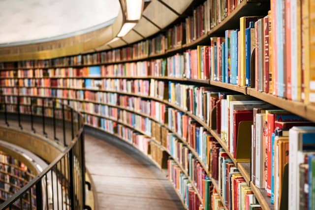 Stack of inspiring books on personal growth and success.